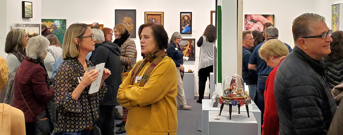 Patrons gathered for the awards presentation at an Annual Juried Art Exhibit