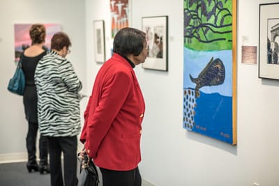 Vistors study paintings and gallery program